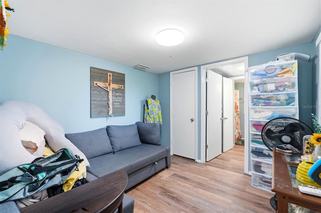 6595 Collier Road St. Augustine, FL 32092 - Photo 94 of 98 a living room with furniture and wooden floor