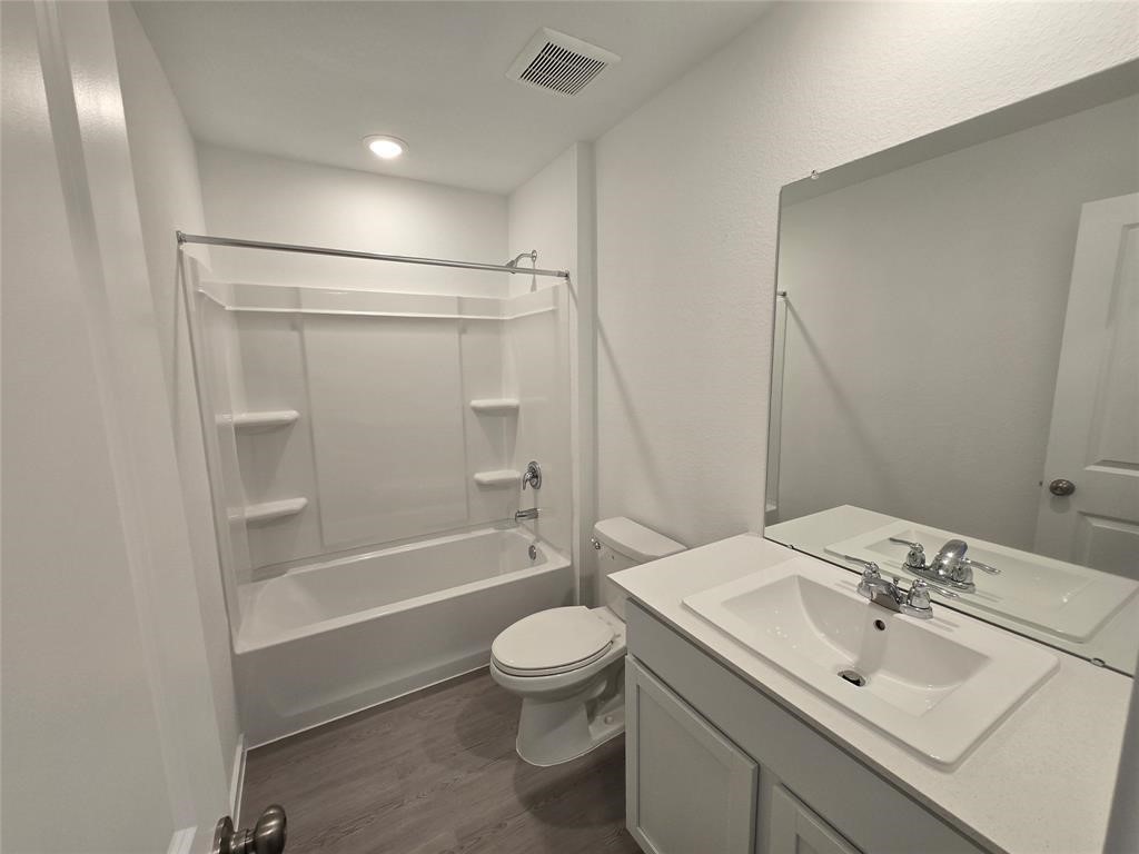 658 Maria Elena Way Cleveland, TX 77327 - Photo 10 of 24 a bathroom with a sink toilet and shower