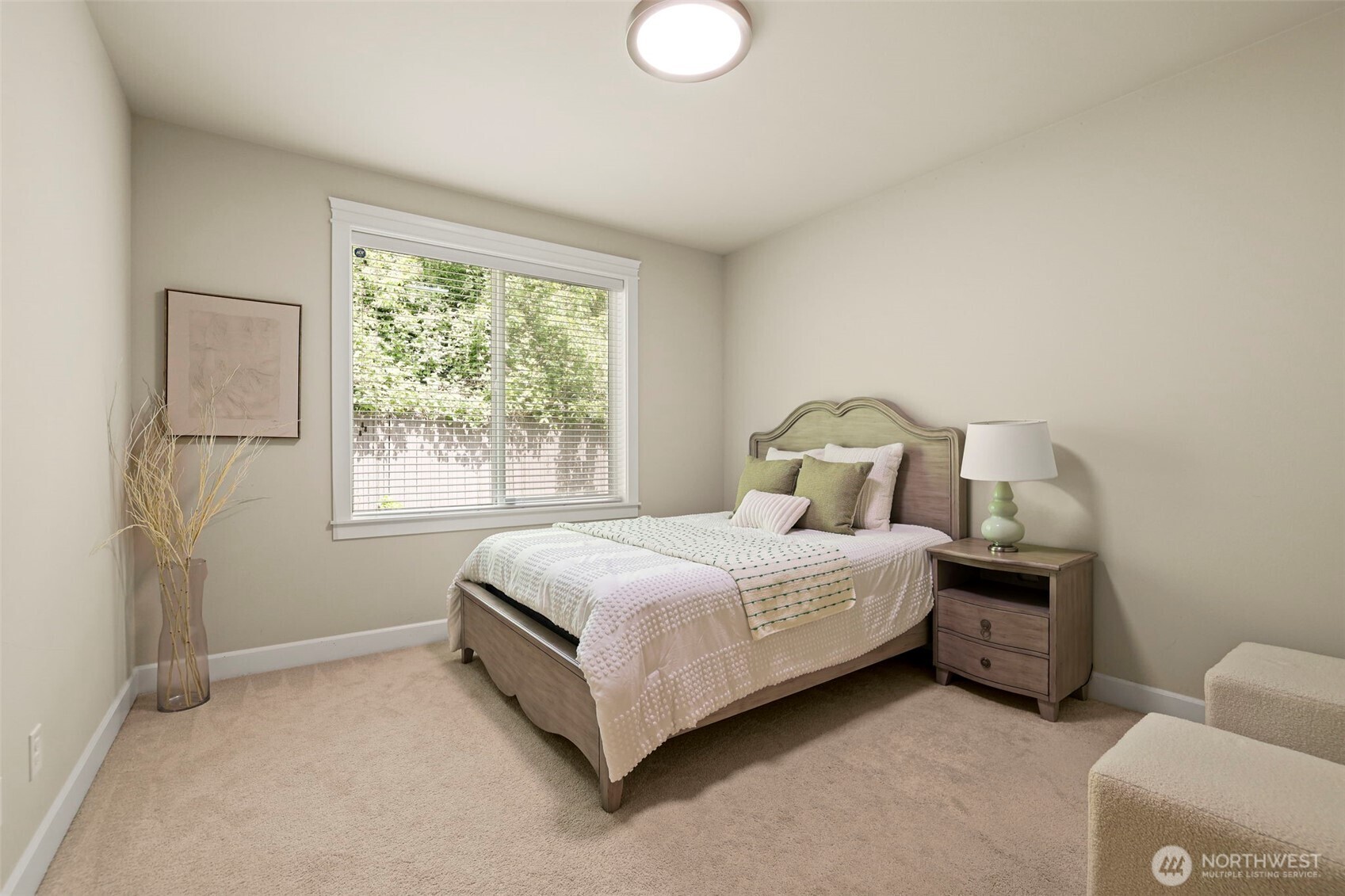 29 242nd Street Southeast Bothell, WA 98021 - Photo 29 of 40 a bedroom with a bed lamp and window