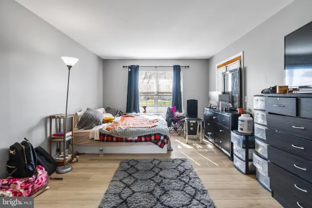 a bed room with a bed and a window