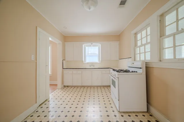 a room with a black white checkered floor