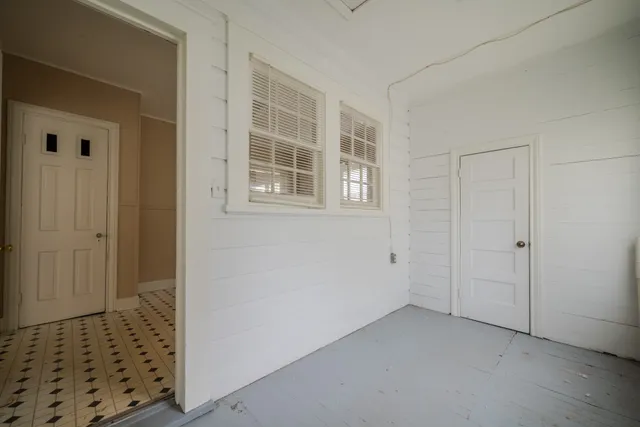 an empty room with windows