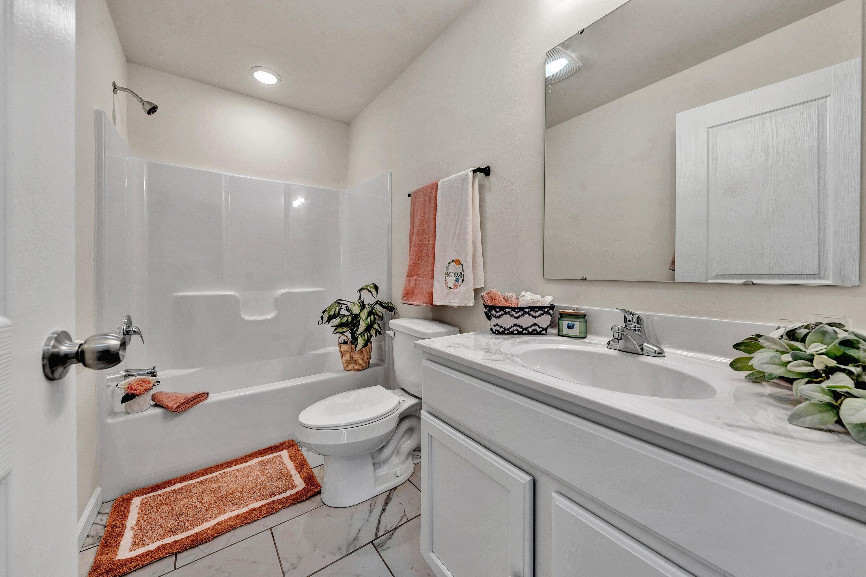 6507 Goodview Road Goodview, VA 24095 - Photo 17 of 28 a bathroom with a sink a toilet and a bathtub