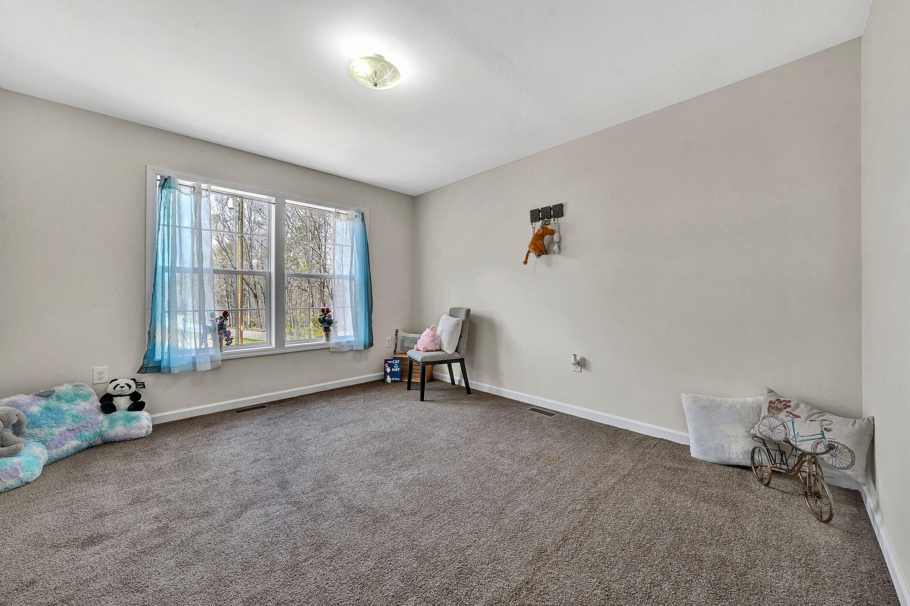 6507 Goodview Road Goodview, VA 24095 - Photo 19 of 28 an empty room with windows