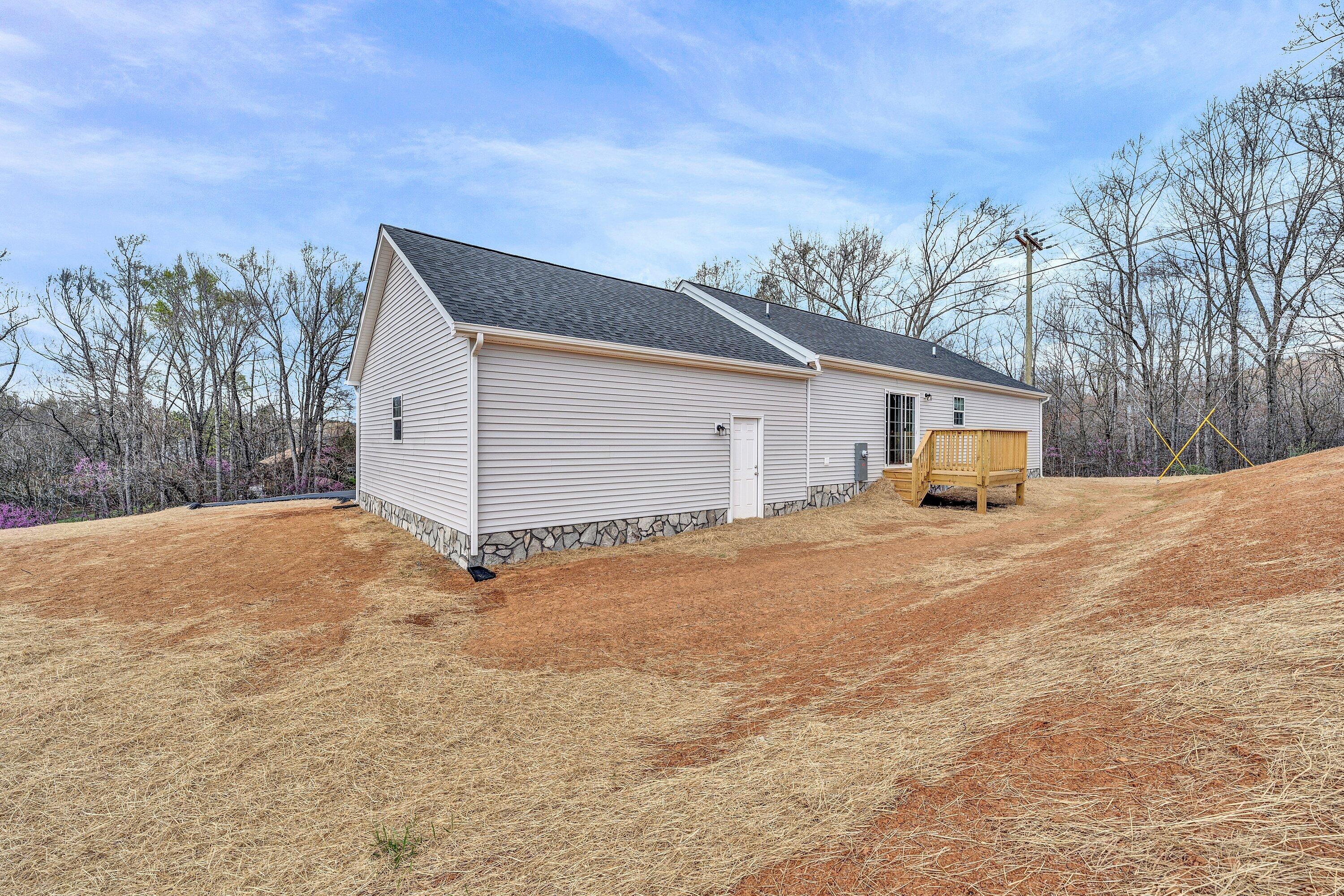 6507 Goodview Road Goodview, VA 24095 - Photo 23 of 28 a view of a house with backyard and trees