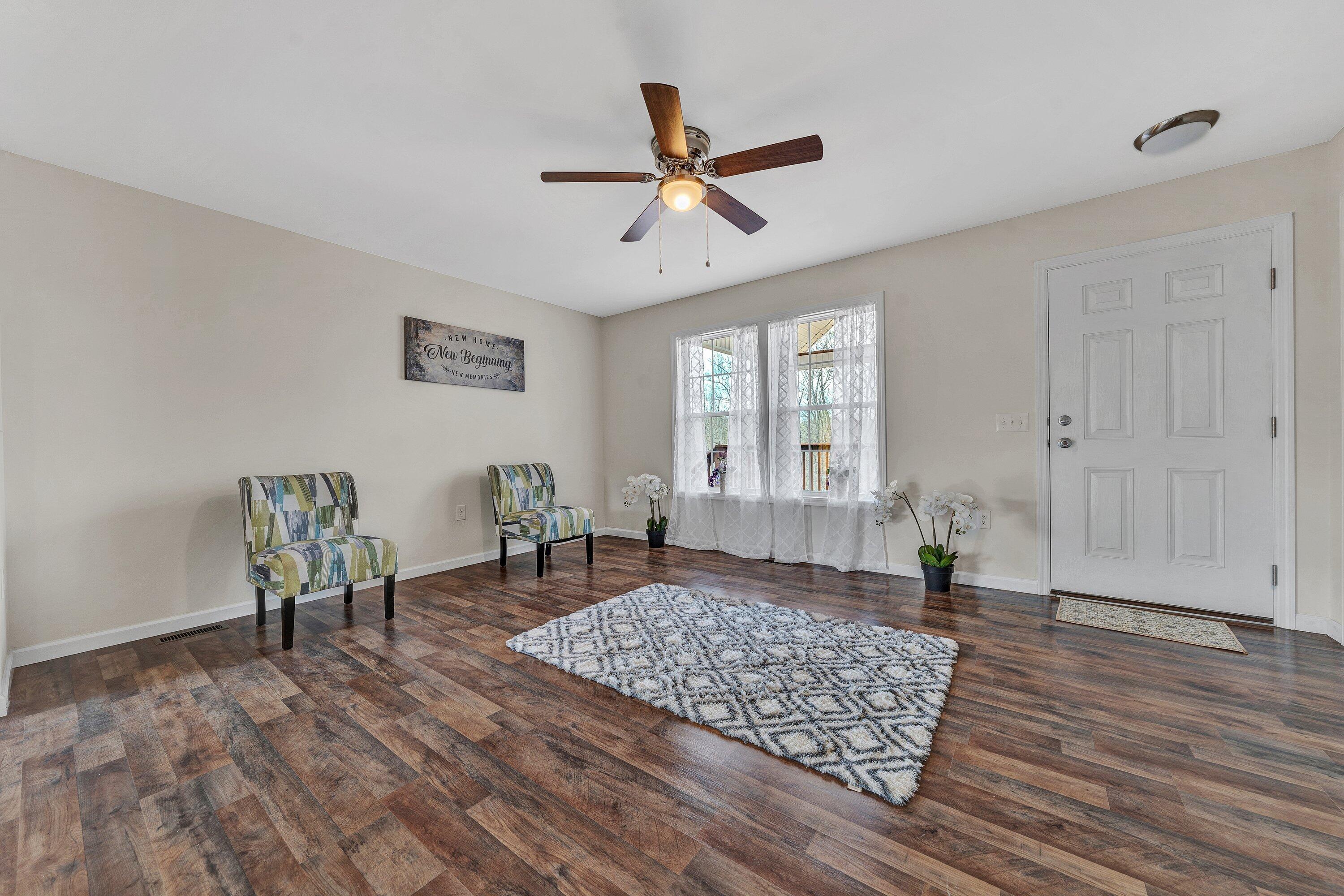 6507 Goodview Road Goodview, VA 24095 - Photo 6 of 28 a living room with wooden floor and a window