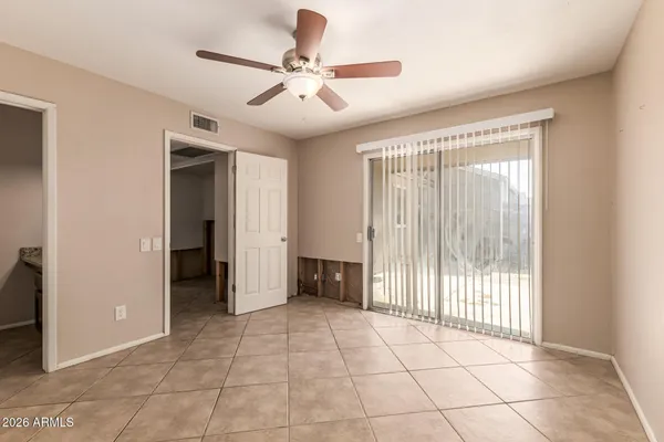 a view of an empty room with a window
