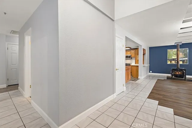 a view of a livingroom with wooden floor and furniture