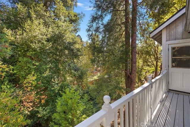 a balcony with trees in front of it