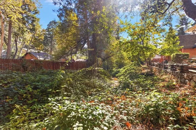 a view of a house with a tree in the background