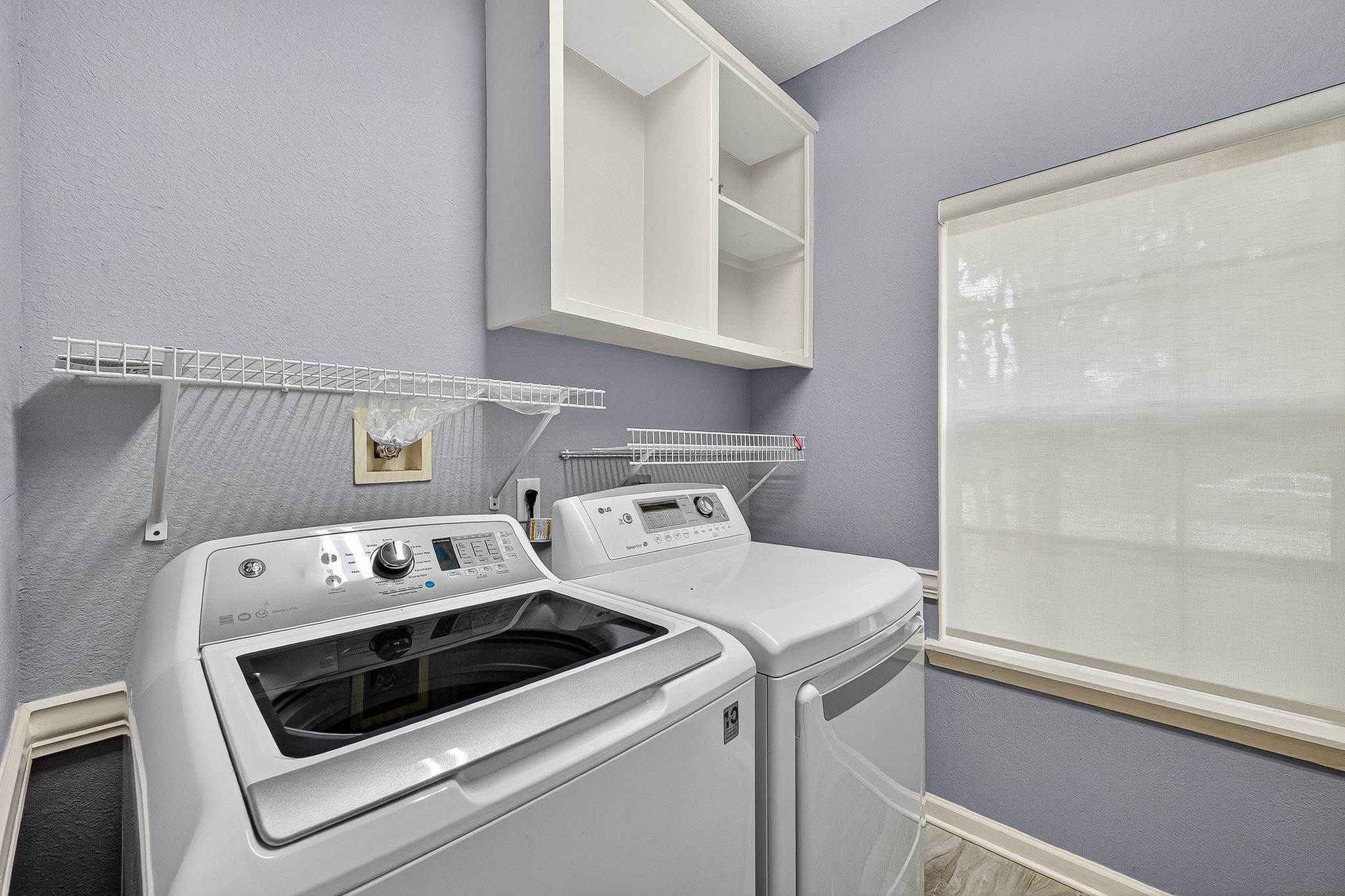 22406 Piper Terrace Lane Katy, TX 77450 - Photo 25 of 44 a view of washer and dryer with kitchen in the background