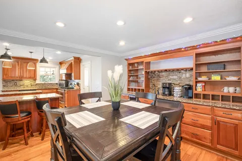 a view of a dining room with furniture window and outside view