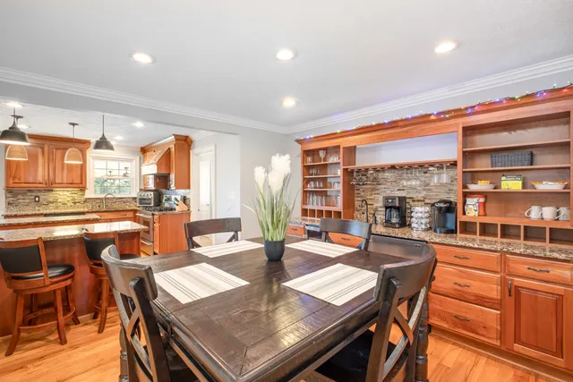 a view of a dining room with furniture window and outside view