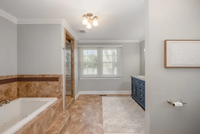 a bathroom with a bathtub and shower