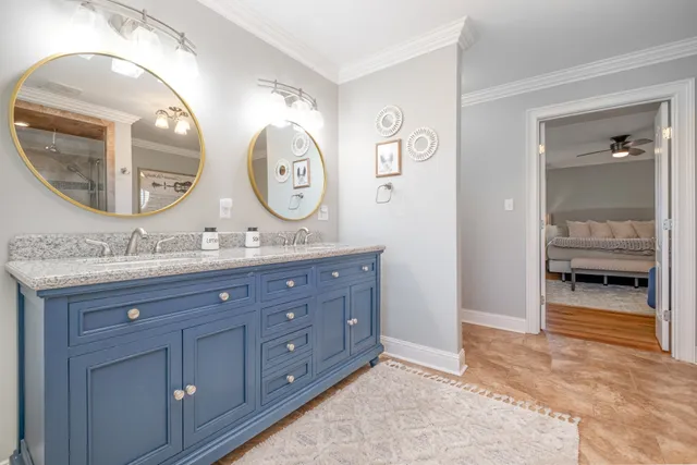 a bathroom with a double vanity sink and a mirror