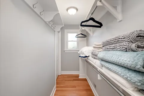 a kitchen with a stove and a chandelier