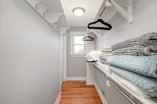 a kitchen with a stove and a chandelier