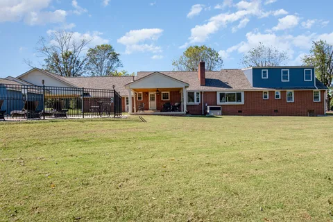 a front view of a building with garden