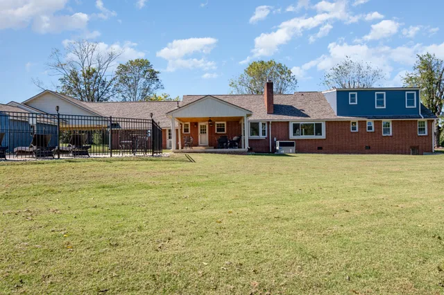 a front view of a building with garden