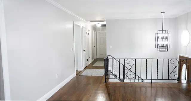 a view of entryway with wooden floor