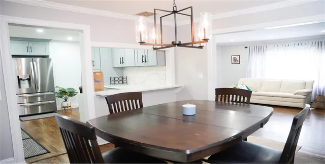 a view of a dining room with furniture and a table