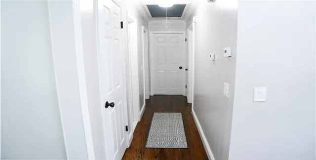 a view of a hallway with a white walls
