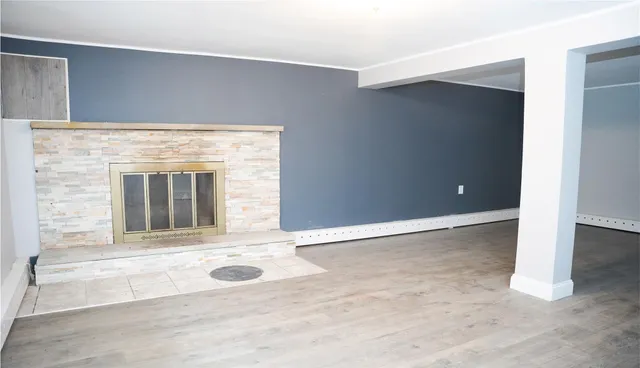 an empty room with fireplace