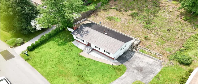 a view of a yard with potted plants