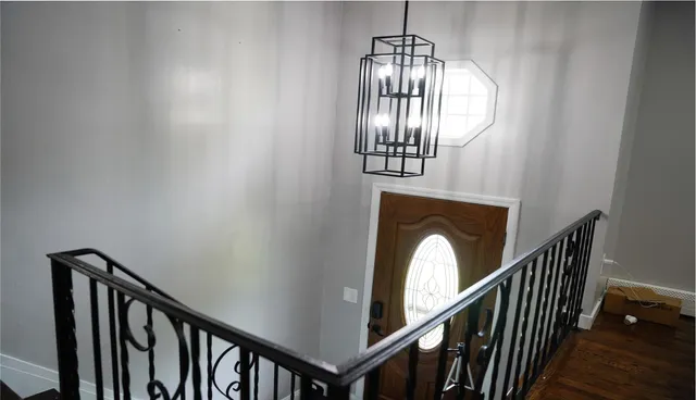 a view of entryway and hall with wooden floor