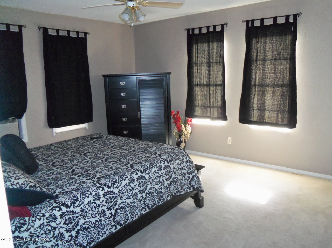 4609 Preston Street Amarillo, TX 79110 - Photo 10 of 15 a bedroom with a bed and a window
