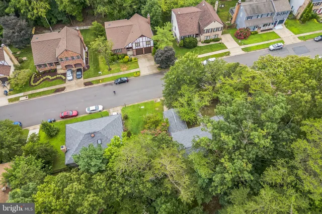 an aerial view of a house with a yard and a garden