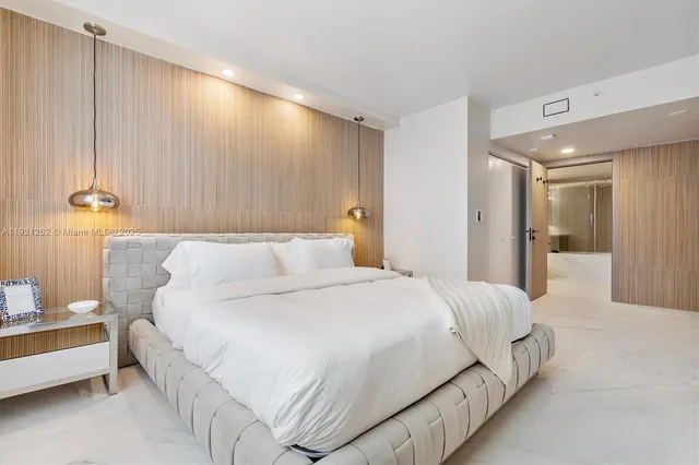 a bedroom with a bed and a table