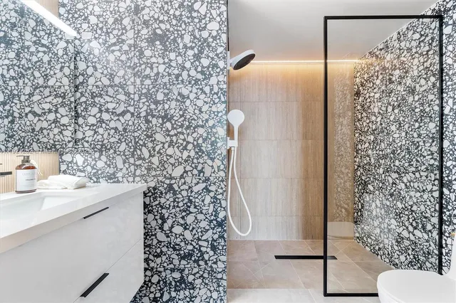 a bathroom with a shower curtain and a sink