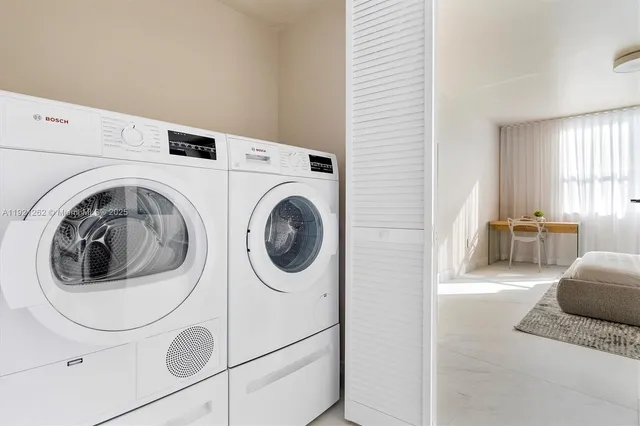 a utility room with dryer and washer