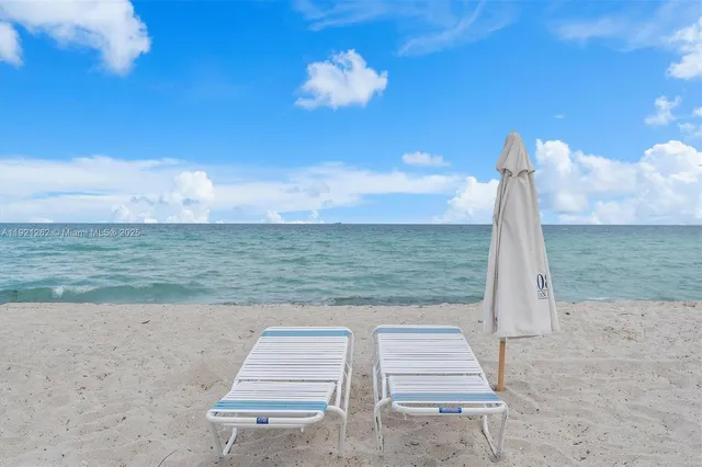 a view of a yard with ocean view