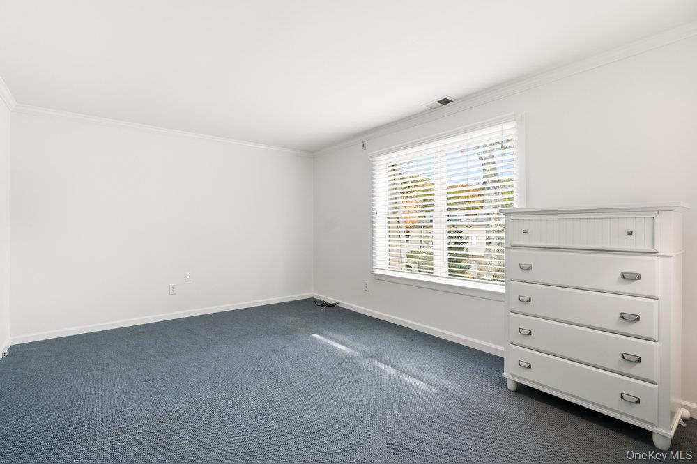 55 Rocky Point Yaphank Road, Unit 38 Rocky Point, NY 11764 - Photo 16 of 25 a view of an empty room with a window