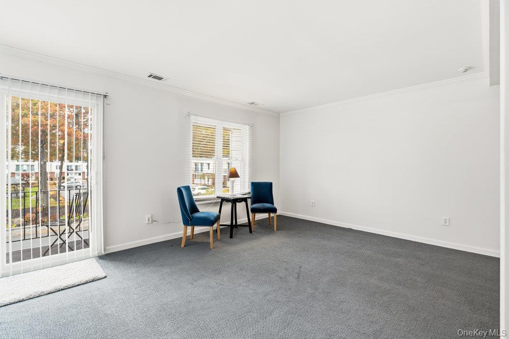 55 Rocky Point Yaphank Road, Unit 38 Rocky Point, NY 11764 - Photo 5 of 25 a view of a livingroom with furniture and a window