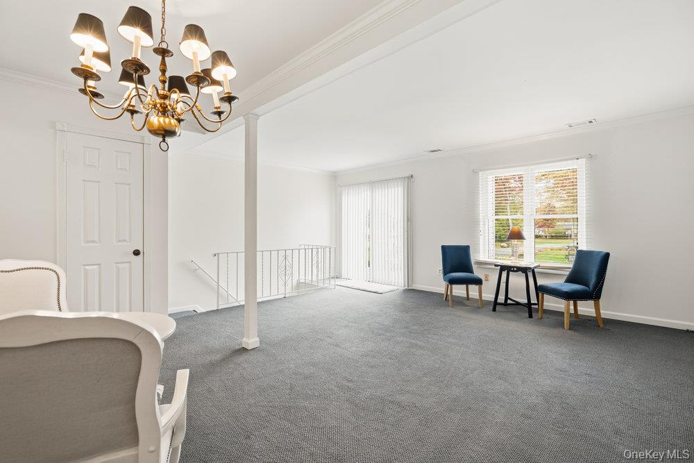 55 Rocky Point Yaphank Road, Unit 38 Rocky Point, NY 11764 - Photo 6 of 25 a view of a livingroom with couch and dining area