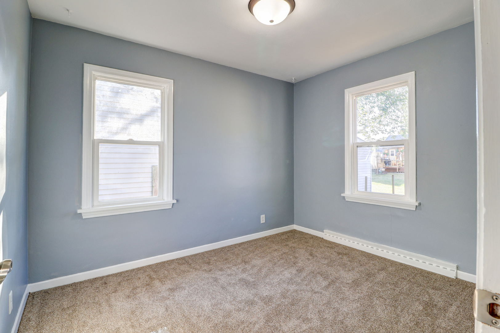 1013 West 8th Street Sterling, IL 61081 - Photo 13 of 22 an empty room with a window