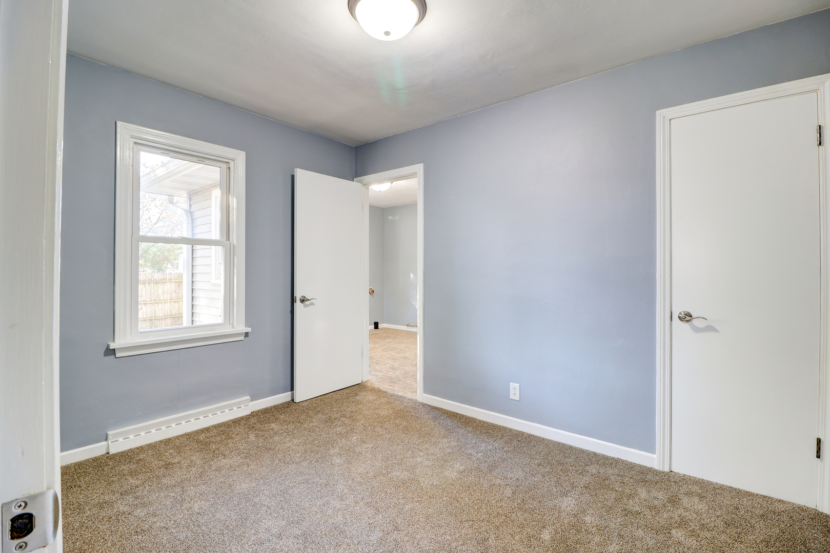 1013 West 8th Street Sterling, IL 61081 - Photo 14 of 22 an empty room with windows