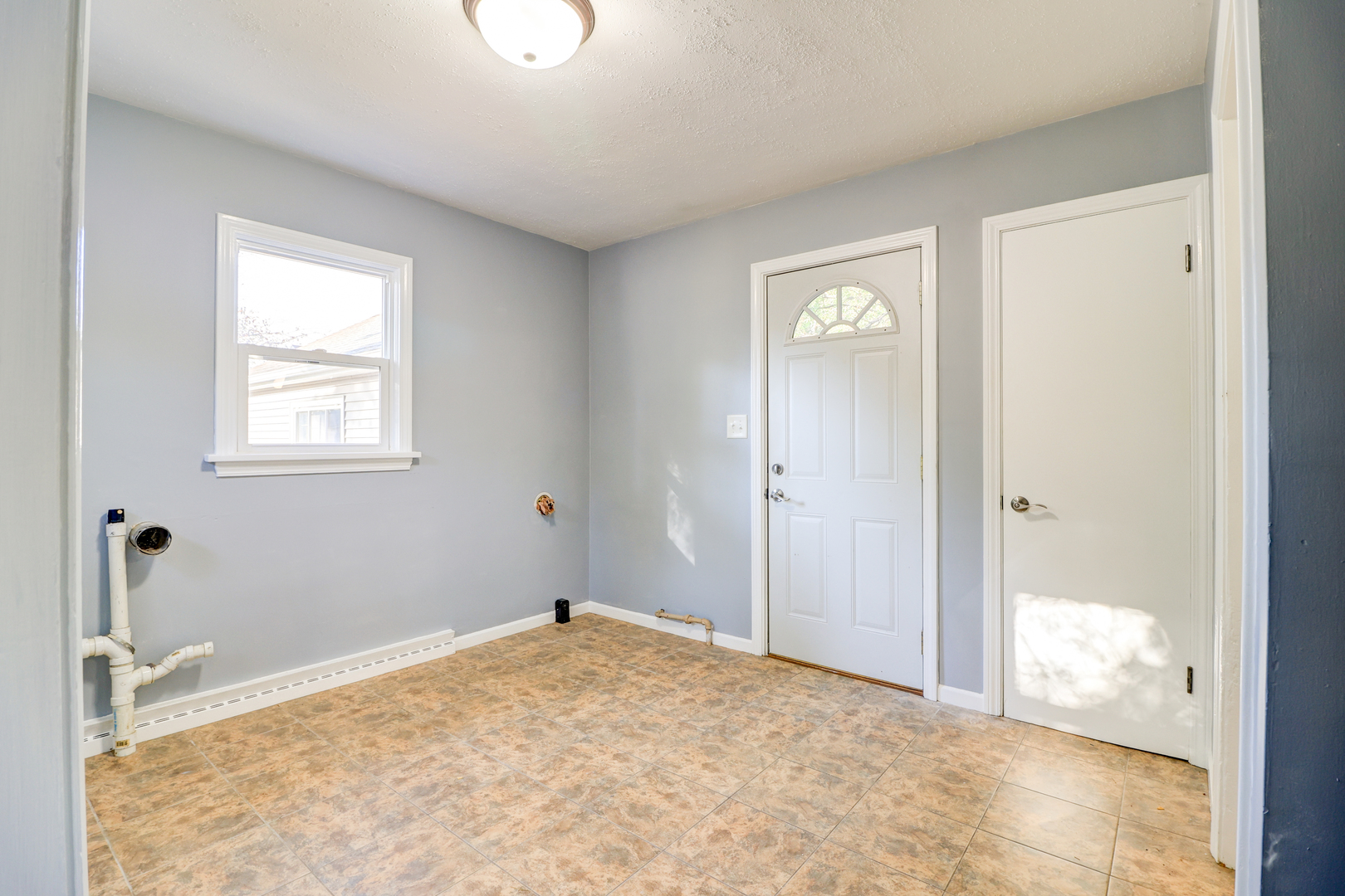 1013 West 8th Street Sterling, IL 61081 - Photo 17 of 22 a view of an empty room with a window