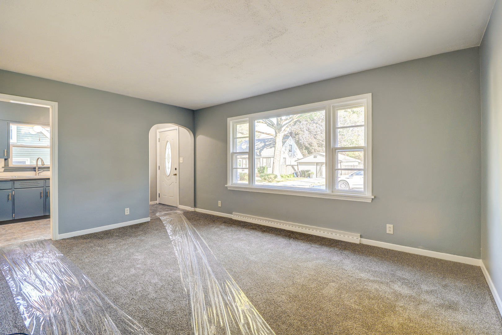 1013 West 8th Street Sterling, IL 61081 - Photo 5 of 22 an empty room with windows