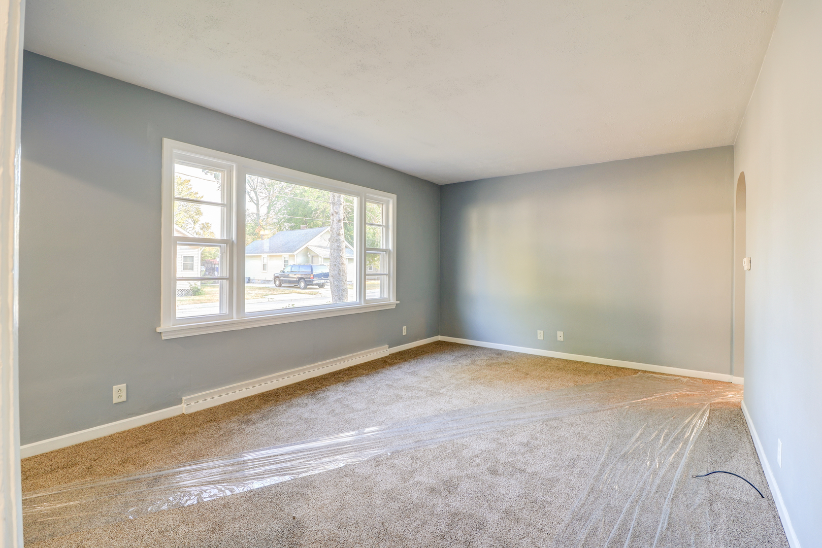 1013 West 8th Street Sterling, IL 61081 - Photo 6 of 22 a view of an empty room with a window