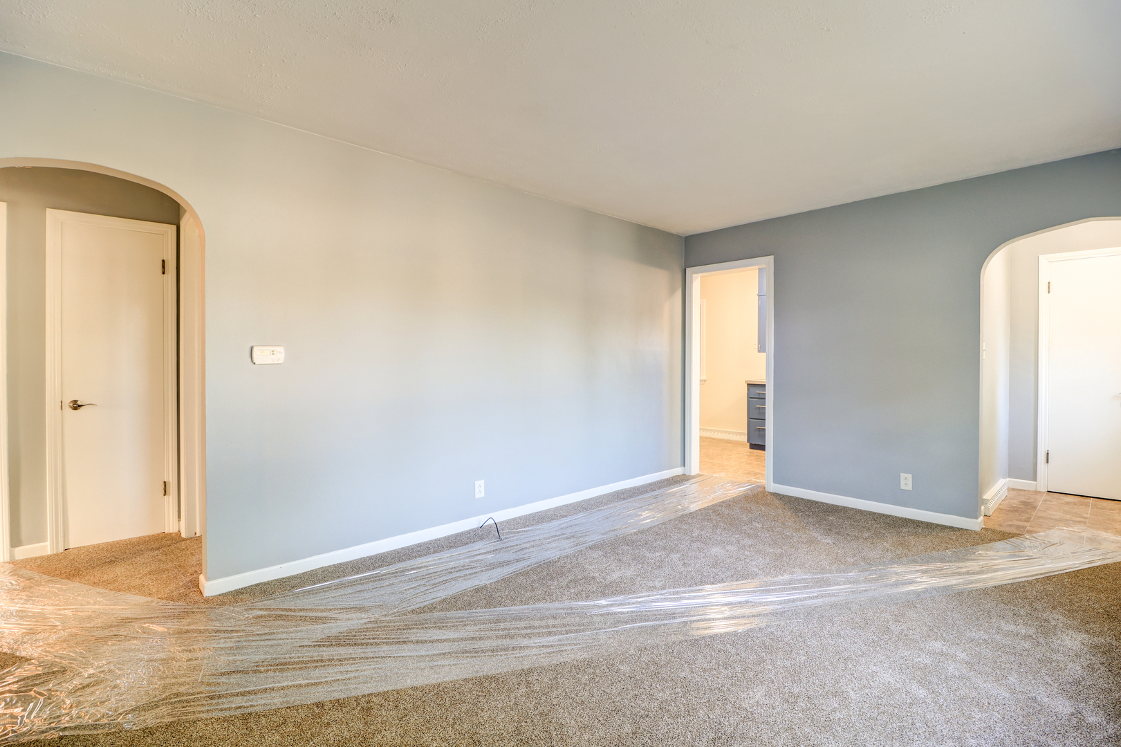 1013 West 8th Street Sterling, IL 61081 - Photo 7 of 22 an empty room with wooden floor and windows