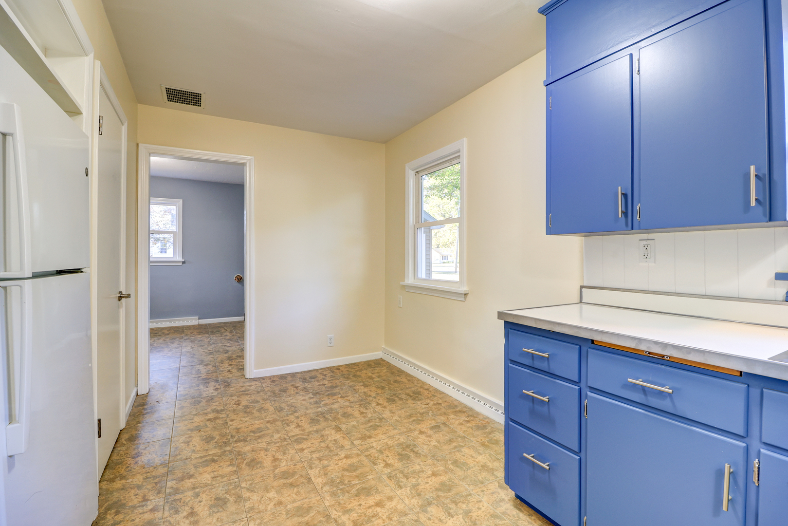 1013 West 8th Street Sterling, IL 61081 - Photo 9 of 22 a view of a kitchen with a sink and cabinets