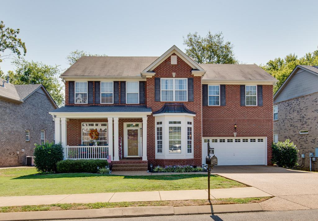 4029 Williford Way Spring Hill, TN 37174 - Photo 1 of 22 a view of a brick house with a yard
