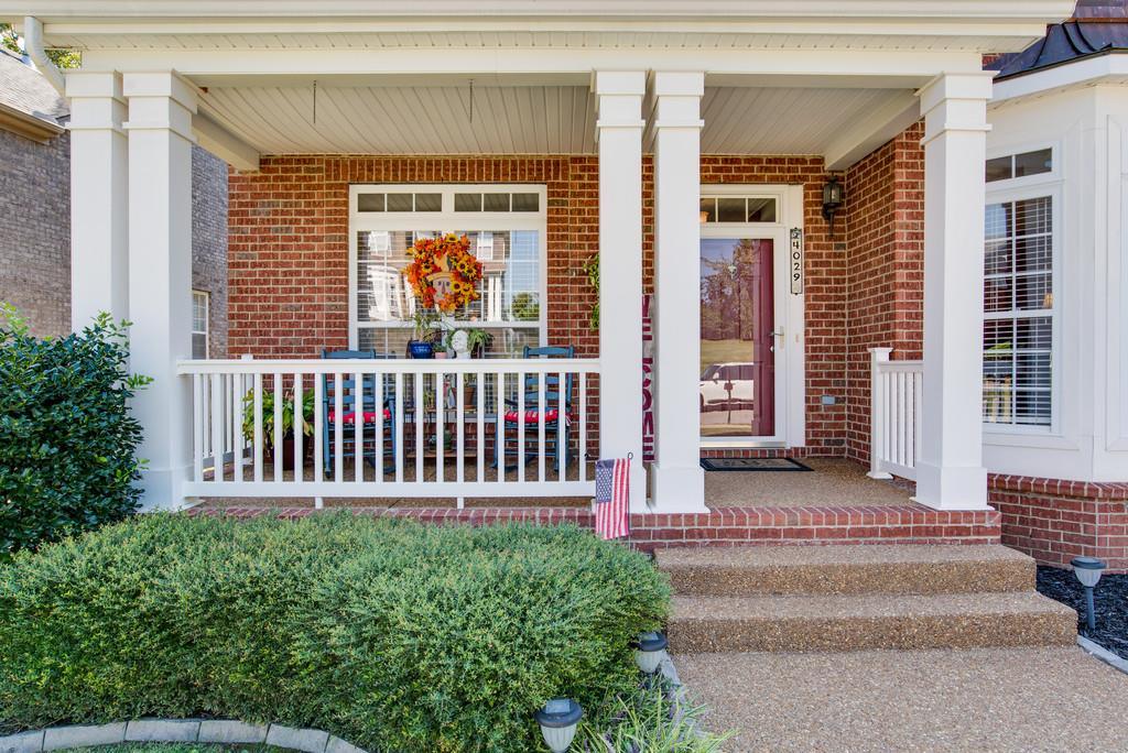 4029 Williford Way Spring Hill, TN 37174 - Photo 2 of 22 a front view of a house with a garden
