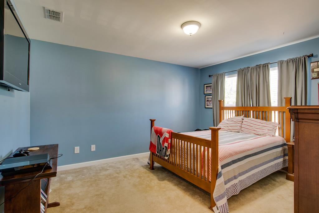 4029 Williford Way Spring Hill, TN 37174 - Photo 17 of 22 a bedroom with a bed and window