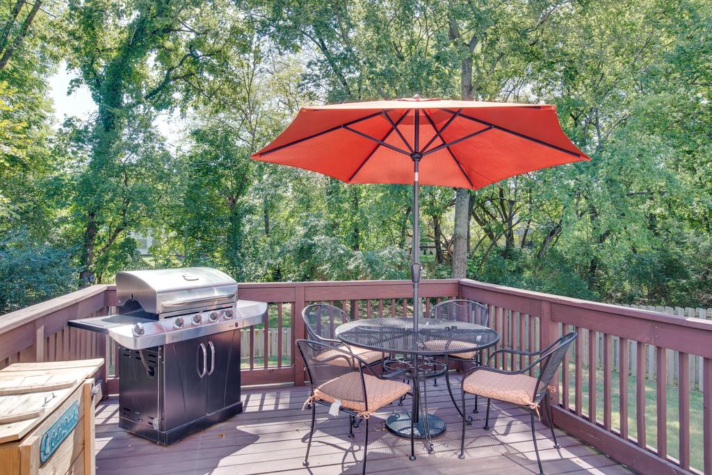 4029 Williford Way Spring Hill, TN 37174 - Photo 22 of 22 an outdoor sitting area with furniture and umbrella