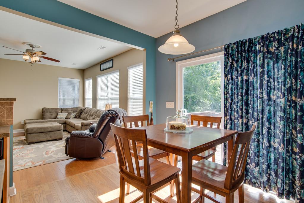 4029 Williford Way Spring Hill, TN 37174 - Photo 8 of 22 a living room with furniture a large window and a chandelier